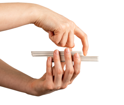 Hand holding tarot deck, cutting part of cards isolated on white background