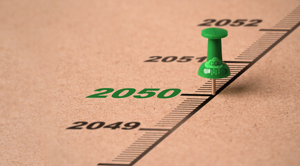 Green pin on 2050 year from Kyoto Protocol with CO2 reducing icon for carbon footprint and carbon...