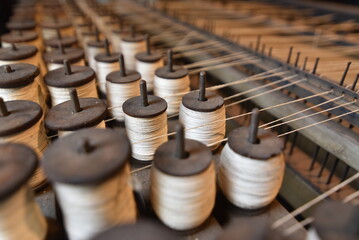 Dozens of spools of thread at an old textile mill.