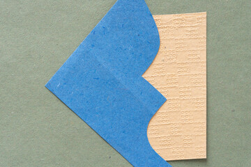 Obraz premium cut blue paper with elegant profile on textured yellow paper