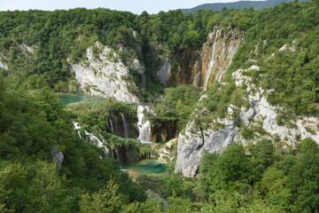 Fototapeta na wymiar Magnificent ponds and waterfalls off the mountains in the Plitvice Lakes National Park, Croatia