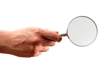 Hand holding metal magnifying glass isolated on white background