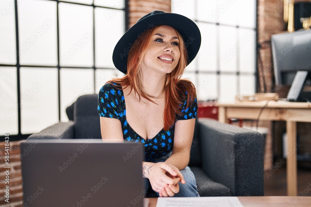 Poster Young caucasian woman musician smiling confident using laptop at music studio