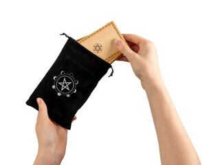 Hands taking tarot cards desk from black small bag isolated on white