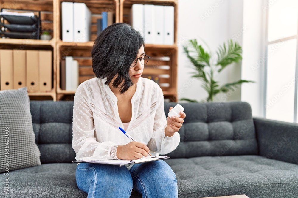 Canvas Prints young latin woman having psychology session prescribe pills at psychology center