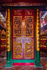 Red and golden door in Buddhist temple in Hong Kong