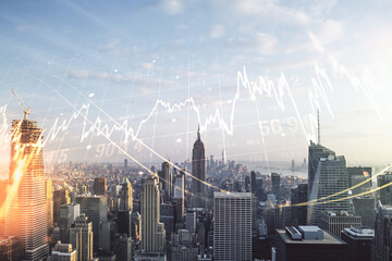 Multi exposure of virtual creative financial chart hologram on New York skyscrapers background, research and analytics concept
