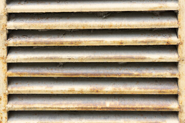 Metal stripes pattern. Ventilation grille texture. Industrial iron metal bars. Grunge grid lines. Gray metal frame background. Rusty parallel lines texture. Dusty metal.