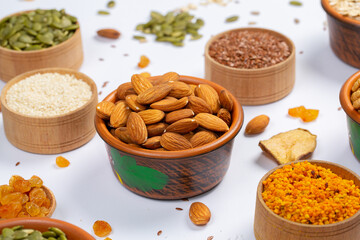 Healthy vegetarian food concept. Assortment of dried fruits, nuts and seeds on white background. Top view.