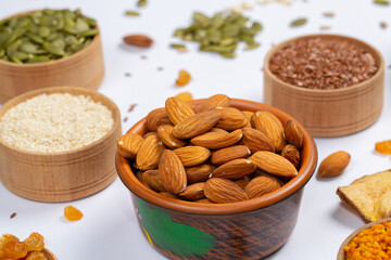 Healthy vegetarian food concept. Assortment of dried fruits, nuts and seeds on white background. Top view.