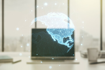 Digital America map on modern laptop background, international trading concept. Multiexposure