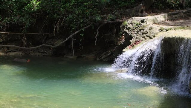 Kawasan waterfall in Bohol, Philippines. Beautiful waterfall with emerald pool in nature