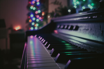 Fototapeta na wymiar Musical Piano and New Year's Night with Christmas Tree Garland. Created with generative technology.