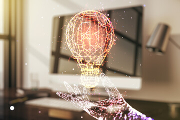 Creative idea concept with light bulb illustration on modern laptop background. Multiexposure
