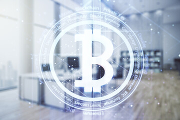 Naklejka premium Virtual Bitcoin hologram on a modern furnished office background. Multiexposure