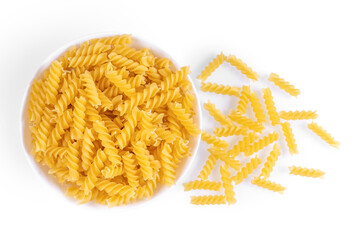 Fusilli in bowl and isolated on white background. Raw pasta spiral shape, ingredient for cook, traditonal italian cuisine. Top view, flat lay