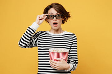 Young surprised shocked amazed woman lower 3d glasses wear casual striped black and white shirt...