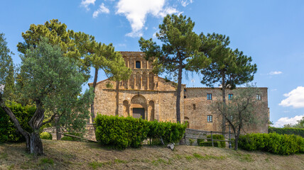 Fototapeta na wymiar The Parish Church of Santa Maria Assunta in Chianni, or more simply Pieve di Chianni, is located in the territory of Gambassi Terme along the route of the Via Francigena. Tuscany, Italy