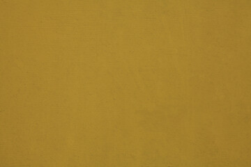 Yellow wall, texture, background. The wooden wall, painted with enamel paint. Flat surface in yellow color. Smooth and glossy surface with a yellow tint
