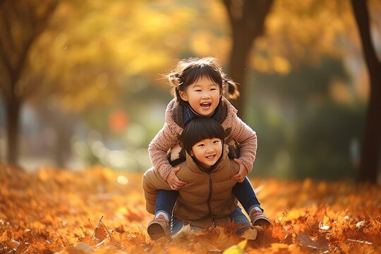 parent and child playing in autumn park
