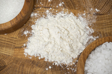 Pasta, flour, sugar, salt on a wooden board. macro photography. Bakery products.