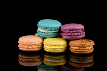 Colorful macaroon over black background