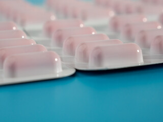 Red medical capsules. Capsules in a blister pack. Close-up.