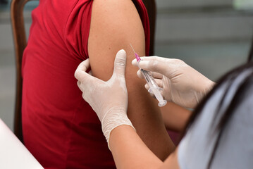 Preventive vaccination The doctor will give the injection to the patient. concept of treatment, prevention, illness