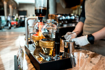 Barista preparing coffee drink at the big shopping mall