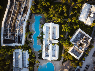 Aerial view of hotel complex with swimming pools, tropical plants. Infrastructure, resort, comfort,...