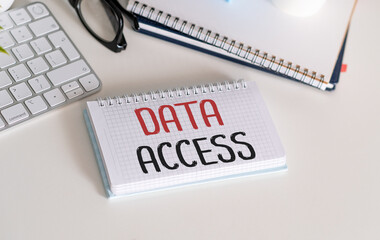 Data Access - text on a notepad and keyboard. Concept of pass or permission to access data.