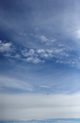 Fototapeta na wymiar Background with white clouds on blue sky at daytime 