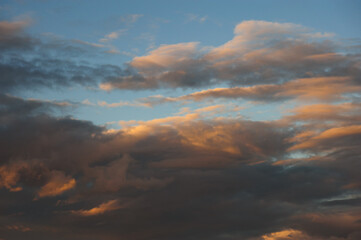 Natural background with clouds on sky at sunset 