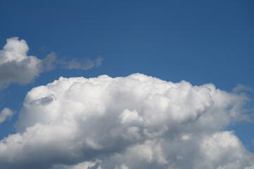 Naklejka na ściany i meble Background with white clouds on blue sky at daytime 
