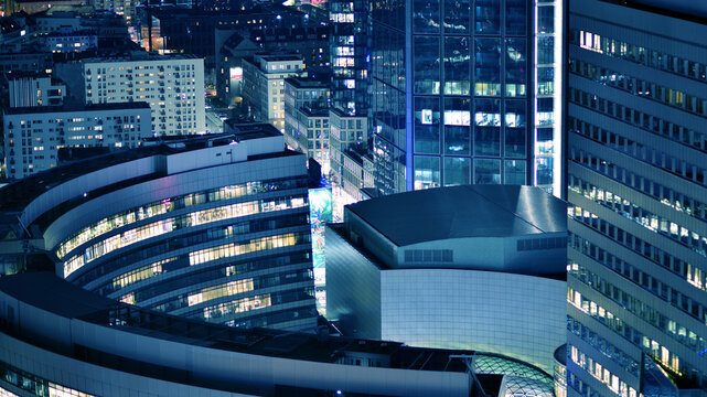View of at night glass buildings and modern business skyscrapers,. View of modern skyscrapers and  business buildings in downtown. Big city at night.