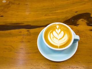 Latte coffee with beautiful latte art poured milk. makes me want to drink all the coffee in the cup.