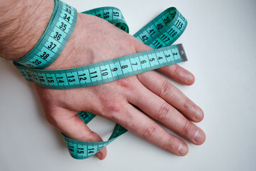 Measuring tape wrapped around the arm