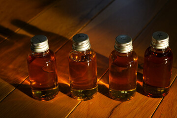 Four small glass bottles for a whisky tasting