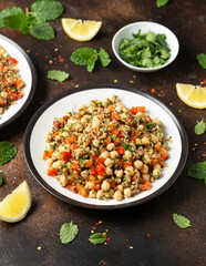 Chickpea Salad with Quinoa, sweet red pepper, herbs and lemon. Healthy food