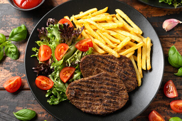 Peppered Vegetarian steaks served with french fries and salad
