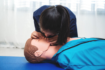 Emergency CPR Training on dummy , open the victim 's airway and give rescue breaths on unconscious...