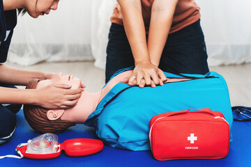 CPR Training ,Emergency and first aid class on cpr doll, Cardiopulmonary resuscitation, One part of the process resuscitation on unconscious person. - obrazy, fototapety, plakaty