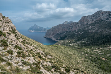 Fototapeta na wymiar Serene valley nestled amidst majestic coastal cliffs in Mallorca