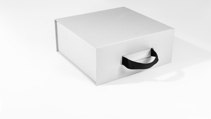 Mockup of a white box with a handle in volume for design