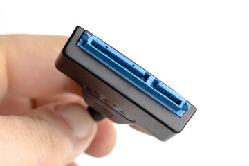 SATA cable for connecting hard drives and solid state drives to a computer. White background