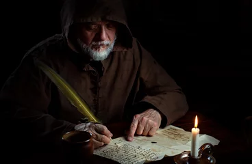 Old monk in the Middle Ages writes message © Thomas Mucha