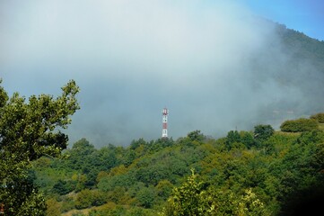 pillar on the hill in the fog