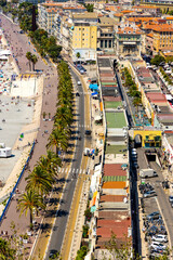 Fototapeta na wymiar Nice panorama with Vieille Ville old town district, Promenade des Anglais boulevard and beach at French Riviera of Mediterranean Sea in France