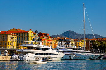 Nice port with yachts, boats and pierces in Nice Port and yacht marina district with Colline du...