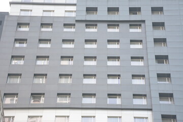 Window in a building. Modern building facade. Window in the facade of a multi-storey building, architecture. High rise building exterior view
